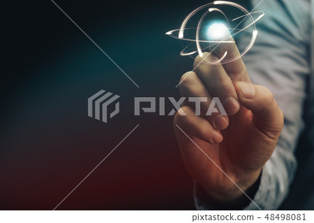 Human forefinger touches green atom. Mixed media. 48498081