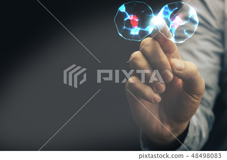 Human forefinger touches cell dividing. Human forefinger touches cell dividing. 48498083