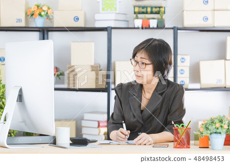 Asian woman working Asian woman working 48498453