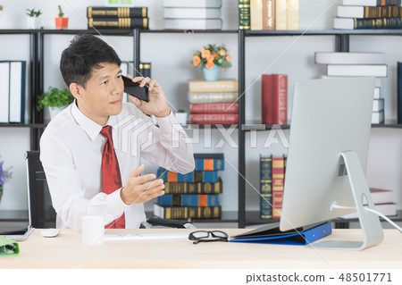 Asian business man at office Asian business man at office 48501771