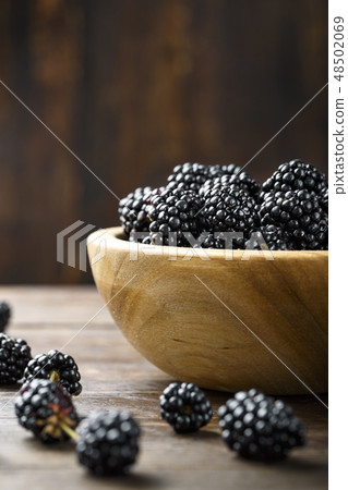 blackberry on wooden background blackberry on wooden background 48502069