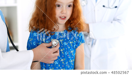 Doctor examining a little girl with stethoscope.Medicine and healthcare concept Doctor examining a little girl with stethoscope.Medicine and healthcare concept 48502567