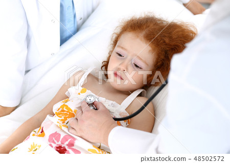 Doctor examining a little girl with stethoscope.Medicine and healthcare concept 48502572