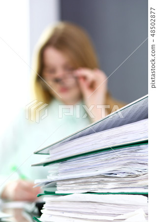 Bookkeeper or financial inspector making report, calculating or checking balance. Audit and tax 48502877