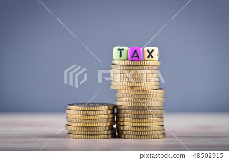 Wood cube with word TAX and stacking coin Wood cube with word TAX and stacking coin 48502915