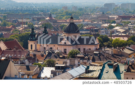 View on the roofs and the church in evening time 48503726