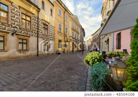 Street caffe in old Krakow in the evening. Street caffe in old Krakow in the evening. 48504106