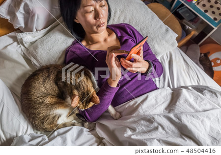 woman with her cat woman with her cat 48504416