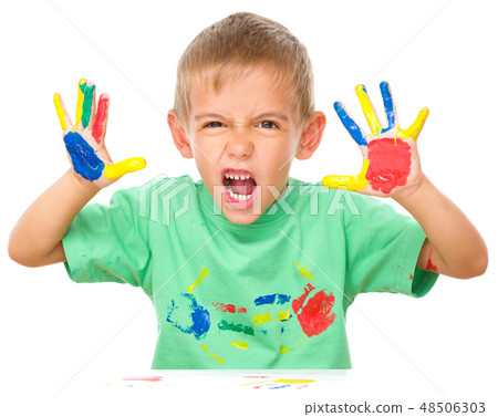 Portrait of a cute boy playing with paints Portrait of a cute boy playing with paints 48506303