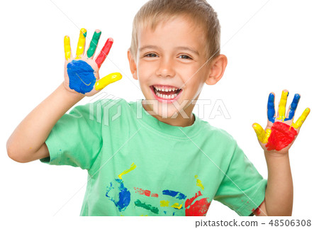 Portrait of a cute boy playing with paints Portrait of a cute boy playing with paints 48506308