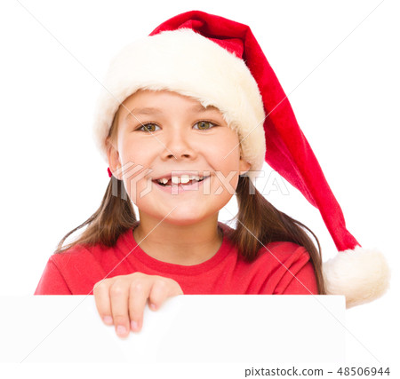 Little girl in santa hat is holding blank board Little girl in santa hat is holding blank board 48506944
