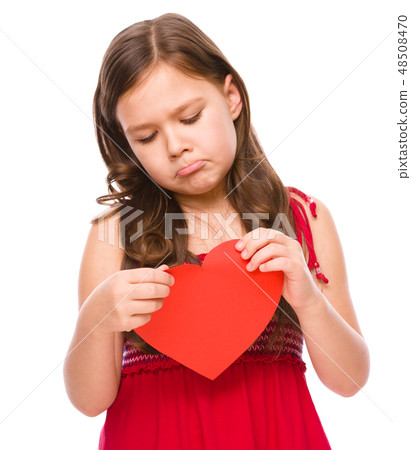 Portrait of a sad little girl in red Portrait of a sad little girl in red 48508470