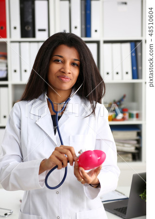 Beautiful black smiling female doctor hold 48510604