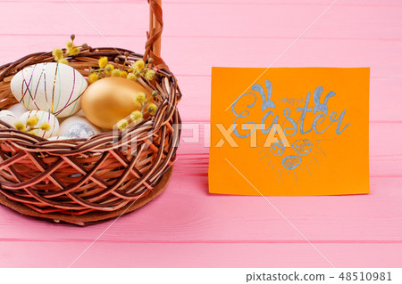 Easter eggs in basket. 48510981