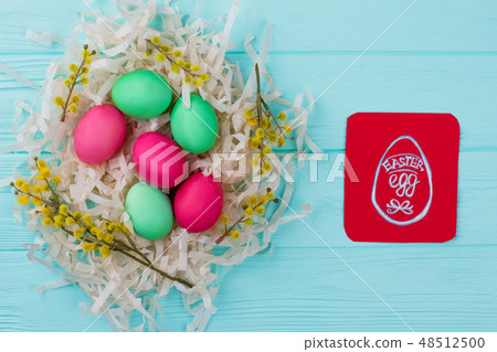 Traditionally painted Easter eggs in nest. 48512500