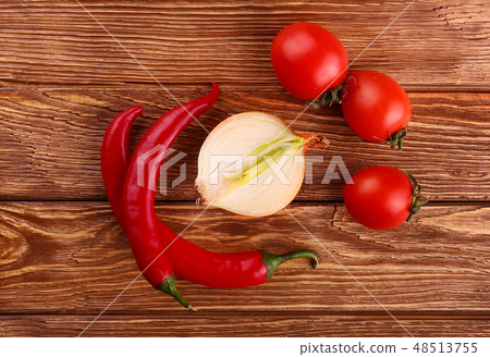 Red hot cherry and chili peppers over white Red hot cherry and chili peppers over white 48513755