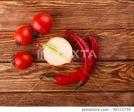 Red hot cherry and chili peppers over white Red hot cherry and chili peppers over white 48513756