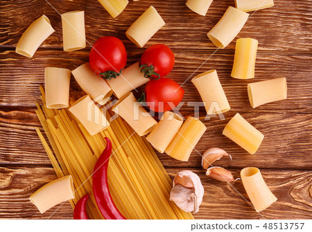 pasta on the wooden chili, pepper, garlic 48513757