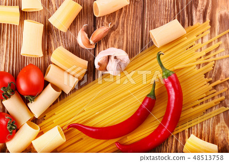 pasta on the wooden chili, pepper, garlic pasta on the wooden chili, pepper, garlic 48513758