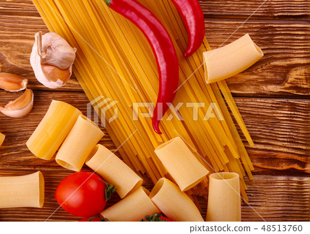 pasta on the wooden chili, pepper, garlic pasta on the wooden chili, pepper, garlic 48513760