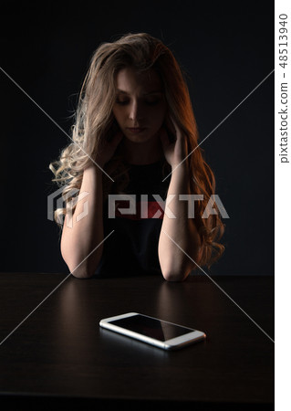 Tired sad teenage girl bullying, front view of scared teenager tired of bullying in social networks Tired sad teenage girl bullying, front view of scared teenager tired of bullying in social networks 48513940