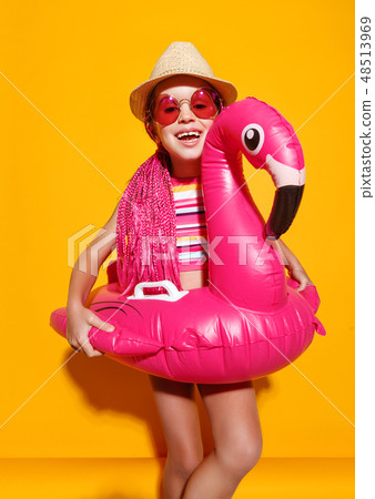 happy child girl in swimsuit with swimming ring happy child girl in swimsuit with swimming ring 48513969