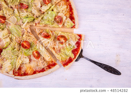 The pizza Caesar cut on pieces is also served a la 48514282