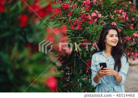 girl near flowers girl near flowers 48514468