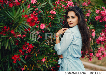 girl near flowers girl near flowers 48514470