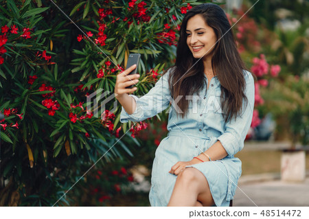 girl near flowers girl near flowers 48514472