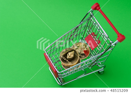 Ethereum coins in a tiny basket shot on chroma key Ethereum coins in a tiny basket shot on chroma key 48515209