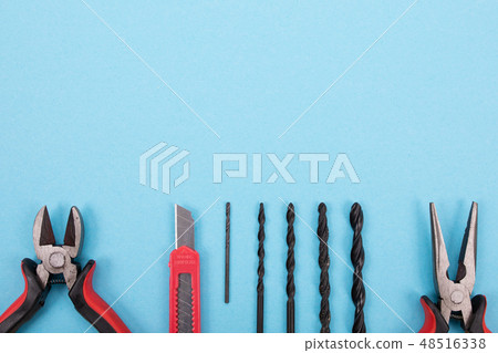 Set of different tools on blue background 48516338