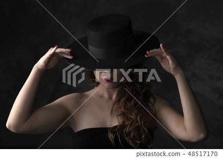 girl wearing an spanish hat girl wearing an spanish hat 48517170