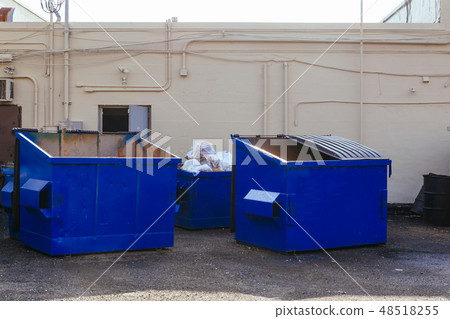 Dumpsters being full with garbage Dumpsters being full with garbage 48518255