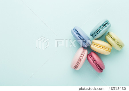 Colorful macarons on turquoise background. Colorful macarons on turquoise background. 48518480