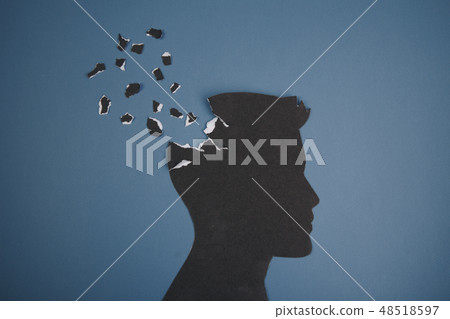 Brain disorder symbol presented by human head made form paper . Creative idea for Alzheimer's Brain disorder symbol presented by human head made form paper . Creative idea for Alzheimer's 48518597