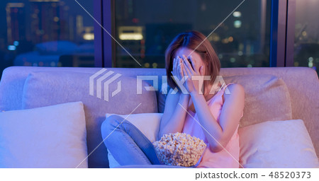 woman watch horror movies woman watch horror movies 48520373