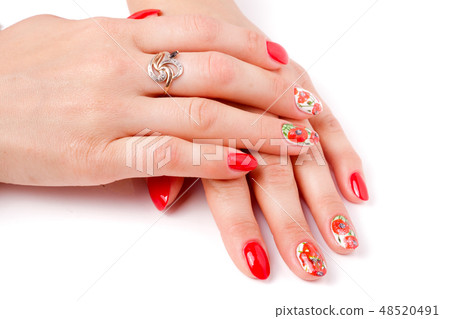 red manicure with a pattern isolated on white background 48520491