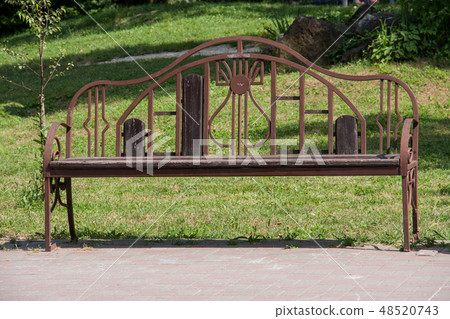 wooden bench in a park close up wooden bench in a park close up 48520743