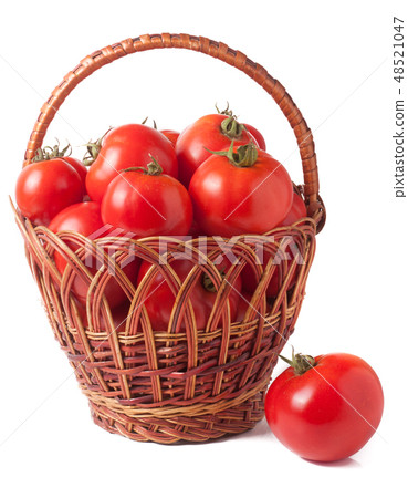 red tomatoes in a wicker basket isolated on white background 48521047