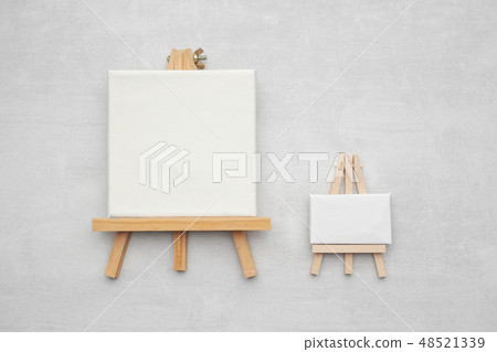 Two small canvases on the easels. Two small canvases on the easels. 48521339