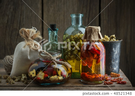 Several bottles of healing infusion or oil. Several bottles of healing infusion or oil. 48521348