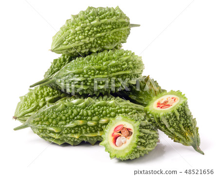 heap of bitter melon or momordica with leaves isolated on white background 48521656