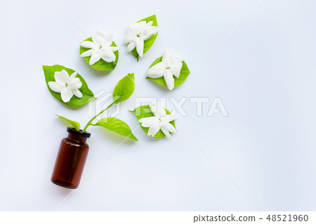 Bottle of essential oil with jasmine flower Bottle of essential oil with jasmine flower 48521960