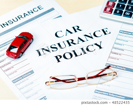 Car Insurance Policy. Document, Car, Glasses and Calculator on Table Car Insurance Policy. Document, Car, Glasses and Calculator on Table 48522435