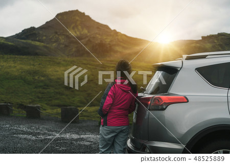 Woman tourist travel by SUV car in Iceland. Woman tourist travel by SUV car in Iceland. 48525889