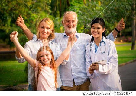 Happy healthy family and doctor talking in park. 48525974