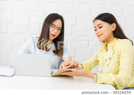 Two Asian architect ladies at office 48526039
