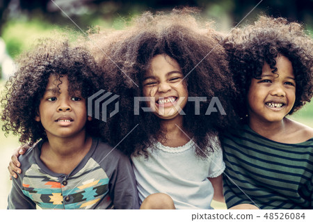 Happy kids group playing in the park in school. 48526084