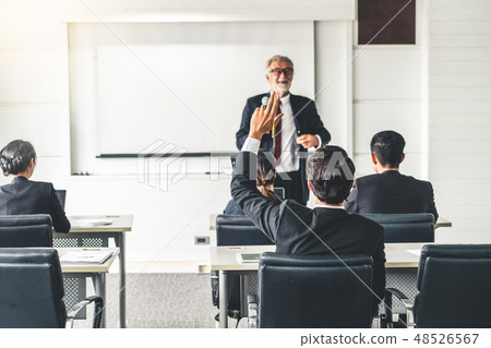 Senior leader speaker speaks to people audience. Senior leader speaker speaks to people audience. 48526567
